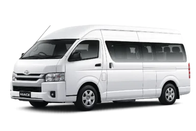 Toyota Hiace Commuter Luxury putih tampak serong depan dan samping untuk layanan sewa Hiace Luxury Jakarta dengan driver profesional