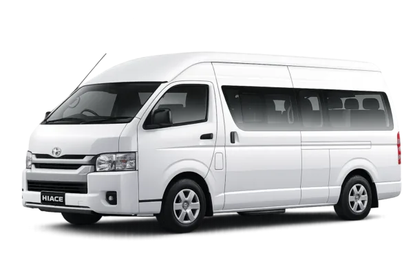 Toyota Hiace Commuter Luxury putih tampak serong depan dan samping untuk layanan sewa Hiace Luxury Jakarta dengan driver profesional